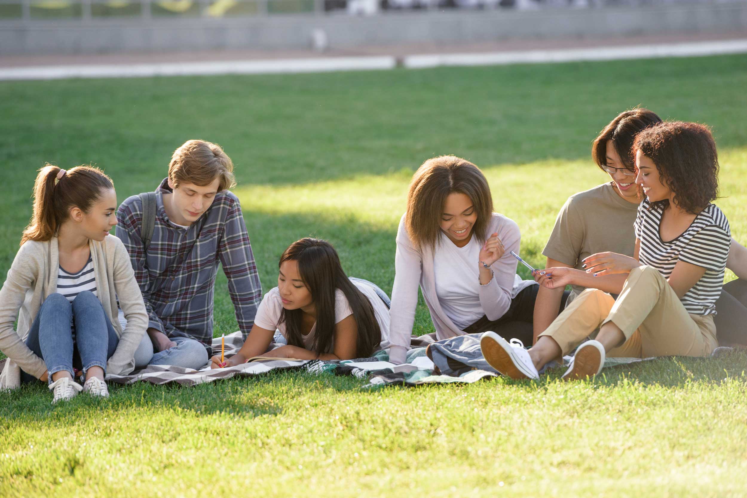 multiethnic-group-young-concentrated-students addition